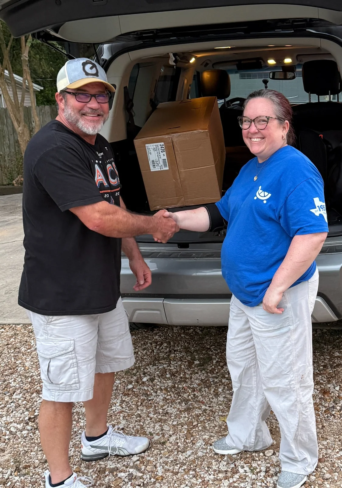 Happy customer shaking hands after a bedding purchase